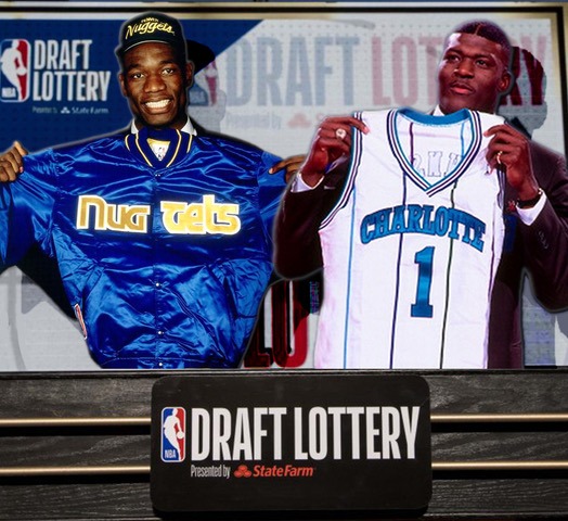 1991 NBA Draft night image of Dikembe Mutombo and Larry Johnson holding a Denver Nuggets jacket and a Charlotte Hornets jersey