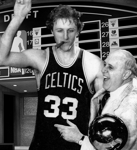 Larry Bird and Red Auerbach positioned in front of a NBA draft board